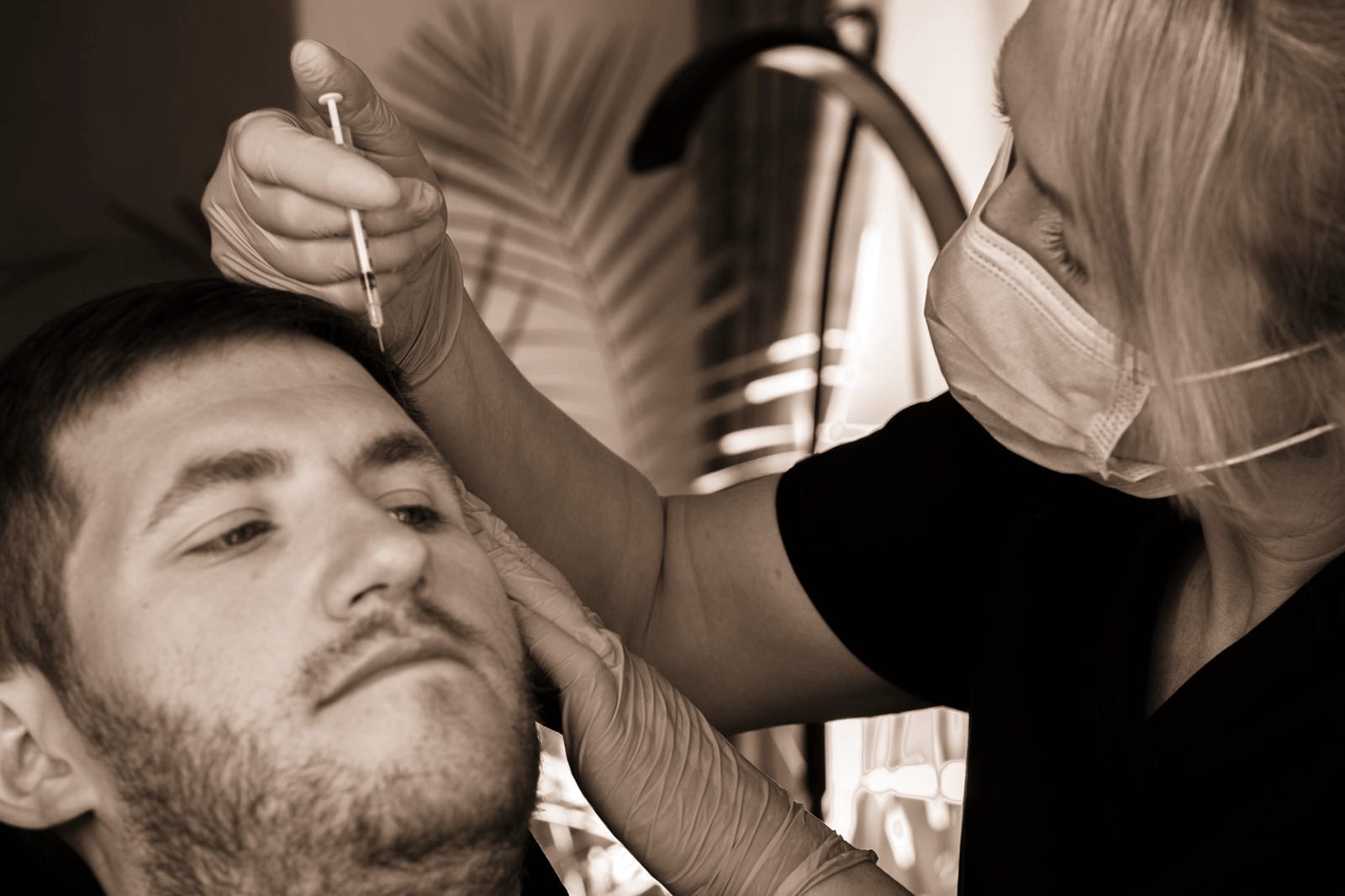 Amy performing an anti-wrinkle treatment on a male client at FaceUp Aesthetics near Pocklington and York